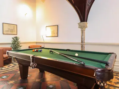 a pool table in a living room with a pool table at The Margaret Suite Stone Cross Mansion in Ulverston