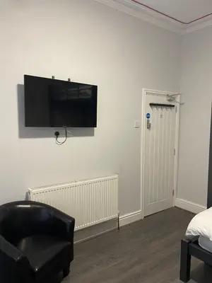 a room with a flat screen tv on a wall at 264 The Road End in Liverpool