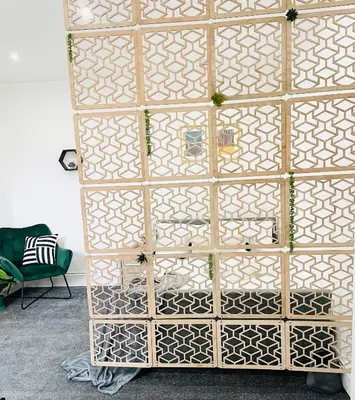 a wooden door with patterns on it in a room at Lovely Estelle Studio Apartment by CityNest in Blackpool