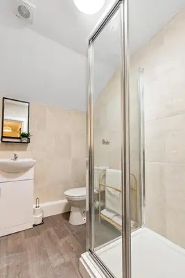 a bathroom with a shower and a toilet at The Snug at The Hideaway STAMP SA in Blackpool