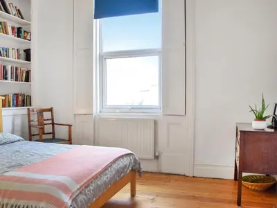 a bedroom with a bed and a window at Anfield Haven in Liverpool