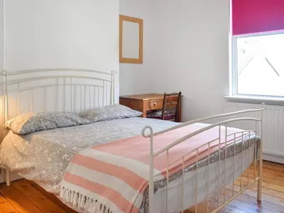 a bedroom with a bed and a window at Anfield Haven in Liverpool