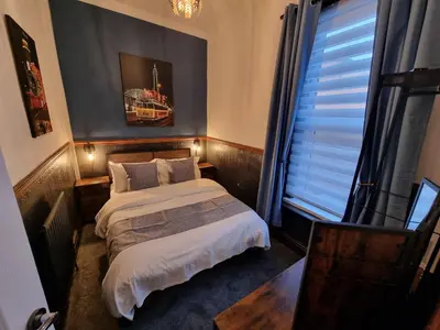 a small bedroom with a bed and a window at Rendezvous Bar & Rooms - ADULTS ONLY in Blackpool