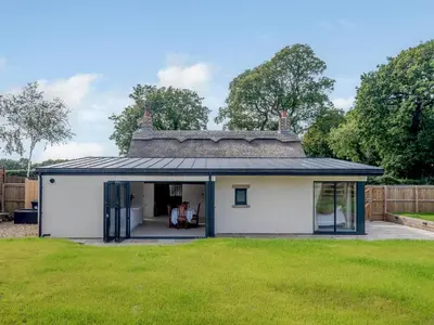 an extension to a house with a roof at The Restored Cottage in Eccleston