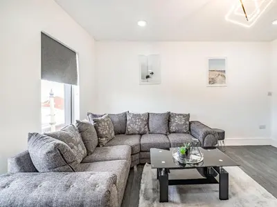 a living room with a couch and a table at Sea View Apartment Two - Uk36847 in Blackpool