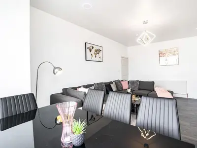 a living room with a couch and a table at Sea View Apartment One - Uk36846 in Blackpool