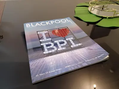 a magazine sitting on top of a table at Black Pearl Luxury Apartments in Blackpool