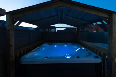 a jacuzzi tub on the roof of a house at HOT TUB JACUZZI on private terrace FREE GATED PARKING sleeps 8 in Blackpool