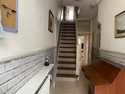 a staircase in a room with a stair case at Renovated 4-Bed Home Sleeps 9 with Parking & Spa in Blackpool