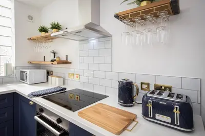 a kitchen with a counter top with a toaster at Blueberries Apartments by Sasco in Blackpool