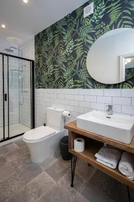 a bathroom with a white toilet and a sink at Blueberries Apartments by Sasco in Blackpool