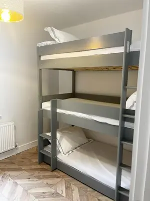 a bunk bed room with two bunk beds at Smith Stayz Apartments in Blackpool