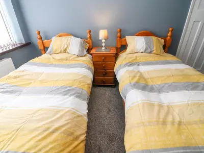 two beds sitting next to each other in a bedroom at 71 Nutter Road in Cleveleys