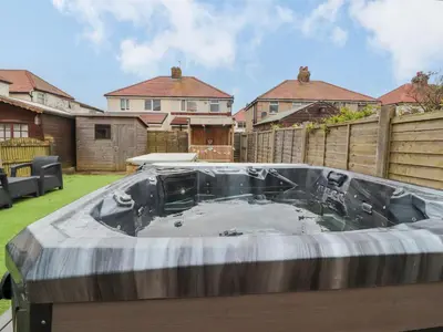 a hot tub in the backyard of a house at 71 Nutter Road in Cleveleys
