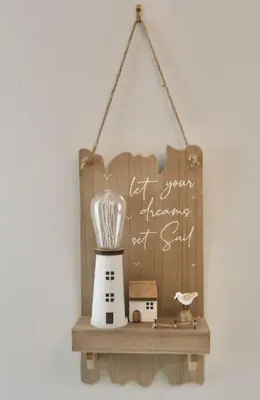 a wooden sign with a blender on a shelf at The Hot Tub Townhouse by Holiday Heim in Lytham St Annes