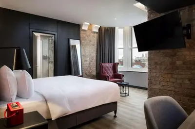 a hotel room with a bed and a tv at Radisson RED Hotel, Liverpool in Liverpool