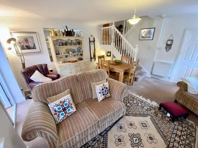 a living room with a couch and a chair at Spacious Two Bedroom House - TM in Southport