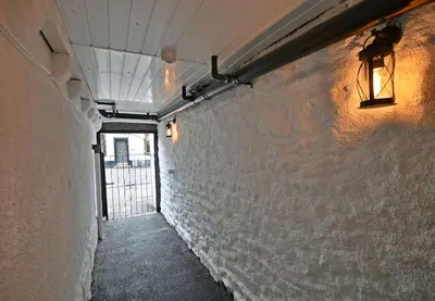 a hallway with a light on the side of a wall at Boutique cottage set in historic town of Clitheroe in Clitheroe