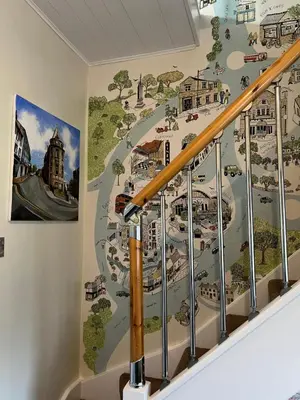 a mural of a city on the wall of a building at Church Mouse Cottage Clitheroe in Clitheroe