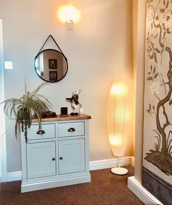 a room with a white cabinet and a mirror at Church Mouse Cottage Clitheroe in Clitheroe