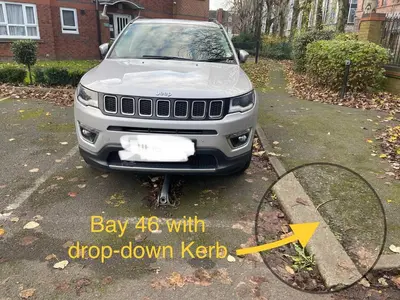 a car parked in a driveway with a tennis racket at Princess Gardens Liverpool Accessible - Infinity in Liverpool