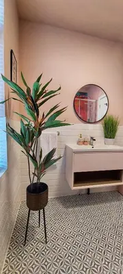a bathroom with a potted plant and a mirror at The Callie by Sasco Apartments in Blackpool
