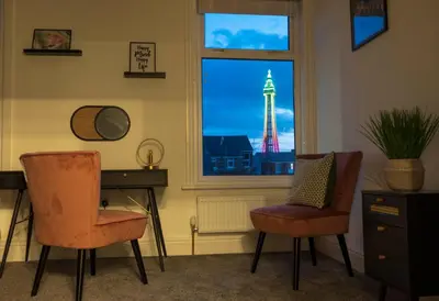 a room with a window with a view of the eiffel tower at The Callie by Sasco Apartments in Blackpool