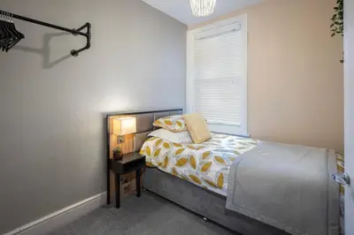 a bedroom with a bed and a window at Coral Boutique Apartment 2 in Blackpool