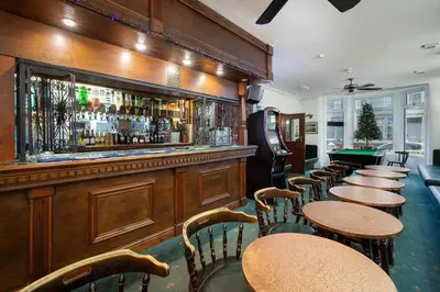 a row of tables and chairs in a bar at Royal Oakwell Hotel in Blackpool
