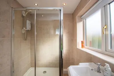 a bathroom with a shower and a sink at *Superb Location* Large 4 Bedroom City Centre Home in Liverpool