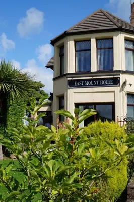 a building with a sign that reads east month house at East Mount House in Barrow in Furness
