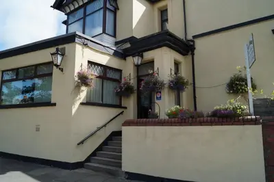a house with flower boxes on the front of it at East Mount House in Barrow in Furness
