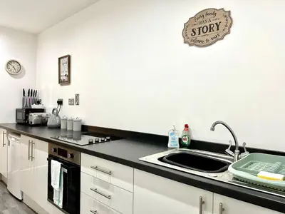 a kitchen with a sink and a counter top at York Street Apartments by Blackpool Service Apartments in Blackpool