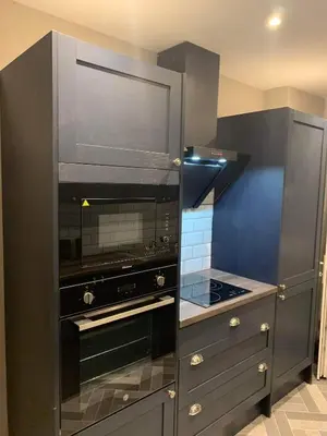 a kitchen with a black oven and a stove at Pleasure Beach View in Blackpool