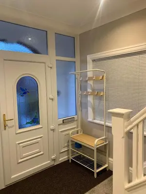 a room with a white door and a stair case at Pleasure Beach View in Blackpool
