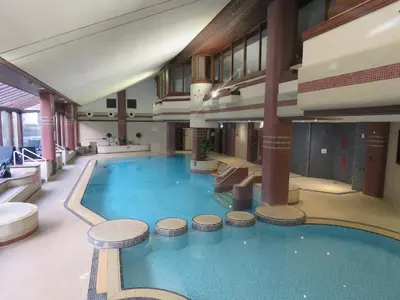 a large swimming pool in a large building at Harbour Retreat in Millom