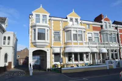 a row of houses on a city street at The Wilton Hotel in Blackpool