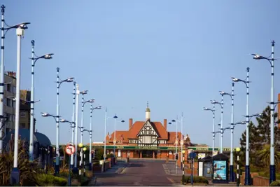 a building on a street with many street lights at Ashton Mews apartment with free parking in Saint Annes on the Sea