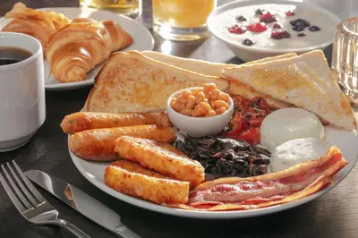 a plate of breakfast food with toast and other foods at Best Western Hotel 99 in Blackburn