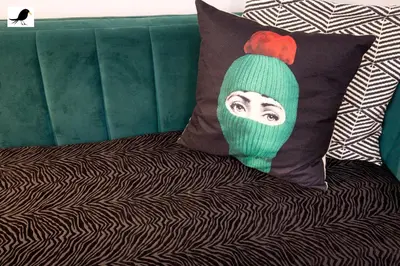 a pillow with a picture of a woman wearing a hat at Blackbird Accommodation and Luxury Apartments room 12 in Blackpool