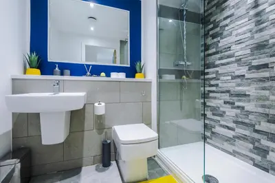 a bathroom with a toilet and a sink and a shower at Bright, Luxury Aparthotel, Excellent Location in Liverpool