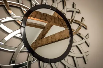 a round mirror with a cross in the middle at Warehouse Apartment-1 King Bed Sleeps 2 in Ulverston
