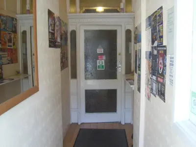 a hallway with a door in a room at Stafford House in Blackpool