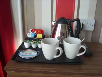 two coffee cups on a tray on a table at Stafford House in Blackpool