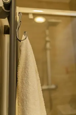 a curtain hanging on a door with a window at Crosby Apartments in Liverpool