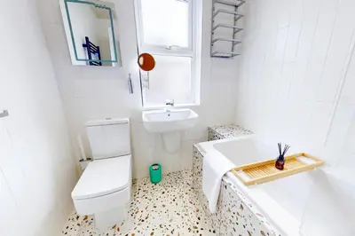 a bathroom with a toilet and a sink and a tub at Lancefield House - Air Host & Stay - 5 Bedroom Sleeps 15 in Walton on the Hill
