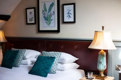 a hotel room with two beds and a lamp at Haighton Manor - Brunning and Price in Grimsargh