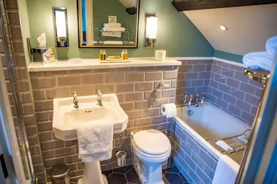 a bathroom with a sink and a toilet and a tub at Haighton Manor - Brunning and Price in Grimsargh