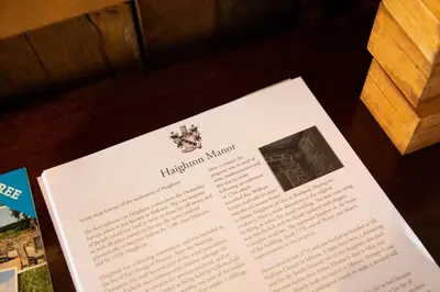 a piece of paper on a table with a book at Haighton Manor - Brunning and Price in Grimsargh