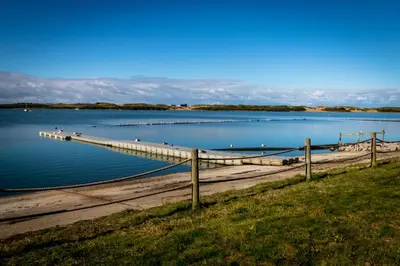 a dock on a large body of water at The Lake House in Liverpool